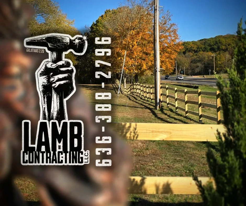 Horizontal wooden fence with posts installed along residential property with autumn foliage